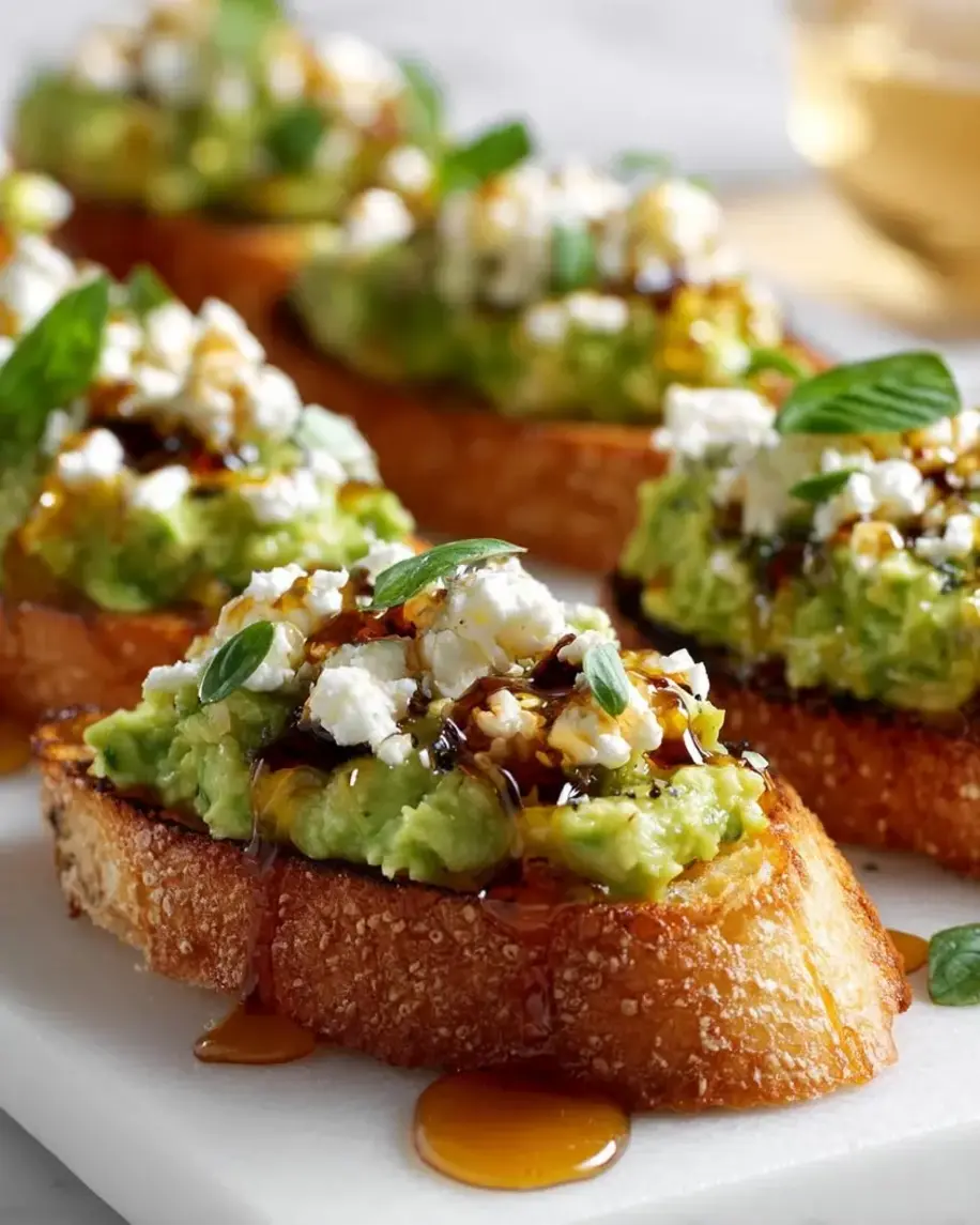 Avocado and Feta Crostini with Hot Honey Drizzle